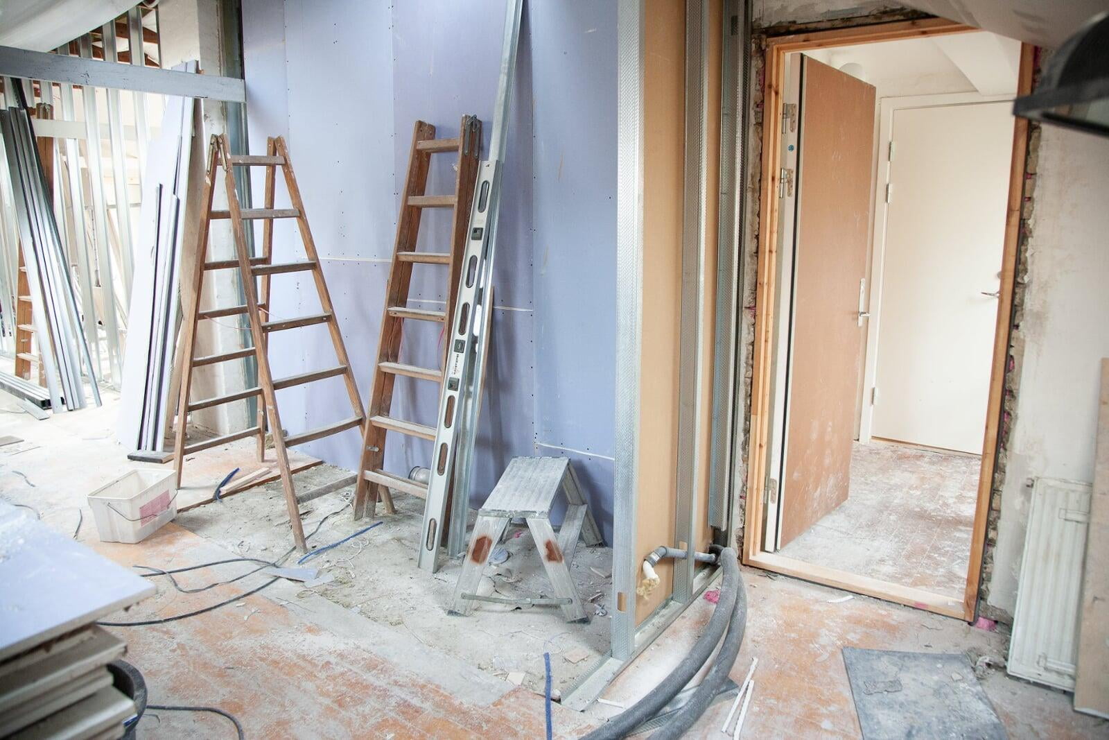 Professional post-construction cleaning crew meticulously sanitizing a newly built Paramus NJ office space. HEPA-filtered vacuums capture microscopic dust particles, ensuring a clean and healthy environment.